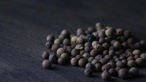 Peppers of black pepper spin on a board Stock Footage 120109646
