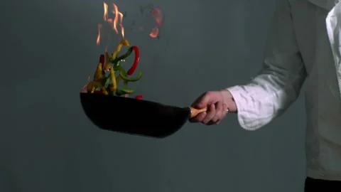 Peppers burning in a pan with big flame Stock Footage 219759601