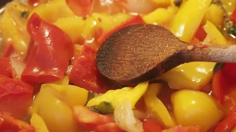 Peppers cooking in a pan Stock Footage 141602994