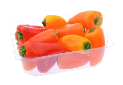 Peppers in plastic container Stock Photos