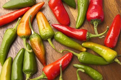 Peppers at vaious stages of ripening. Stock Photos