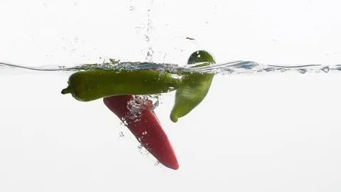 Peppers in a water Stock Footage 99724898