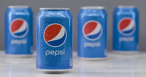 Pepsi metal cans in small drops of water on blue background. Stock Footage 144207253