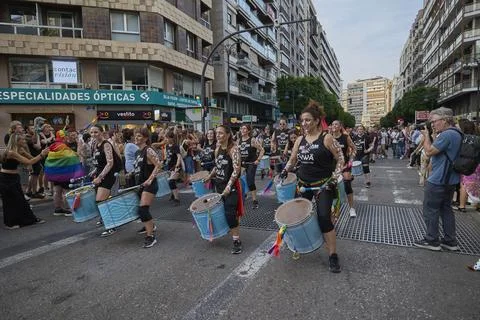 Percussion group performing music during pride parade procession downtown Stock Photos