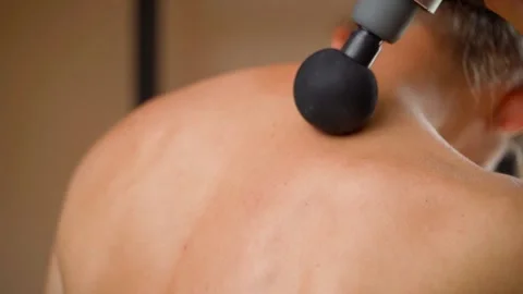 Percussion massage of the trapezius and ... | Stock Video | Pond5