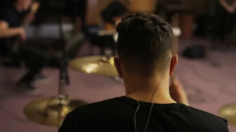 Percussionist Playing a Drum Set Seen From the Back Stock Footage 72190796