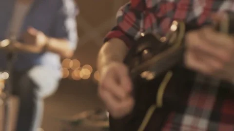 Percussionist Playing Drums and a Young Man Playing Ukulele Stock Footage 74492109