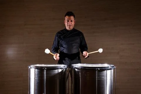 Percussionist practicing with two drums Stock Photos
