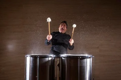 Percussionist practicing with two drums Stock Photos