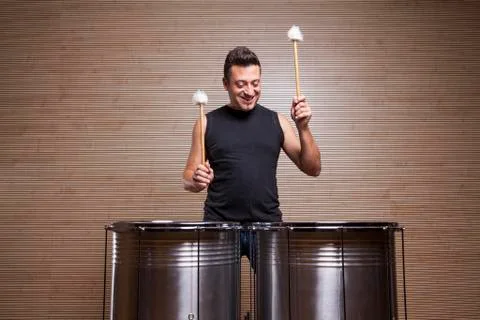Percussionist practicing with two drums Stock Photos