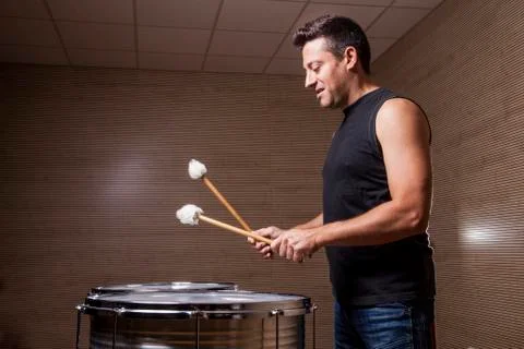 Percussionist practicing with two drums Stock Photos