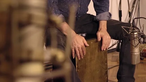 Percussionist recording cajon Stock Footage 213609747