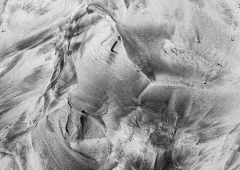 Perfect abstract pattern of sea sand formed after the tide 스톡 사진