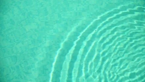 The perfect aquamarine surface of a filled pool. slow-mo video of water ripples Stock Footage 157985824