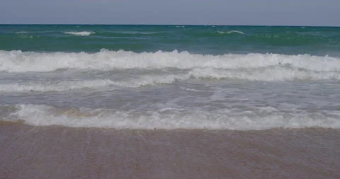 A perfect beach and ocean waves rolling into sandy shore Stock Footage 150642714