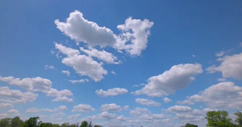 Perfect Blue Sky with Puffy White Clouds Colored and Saturated 4k Plate 16mm 動画素材 154272664