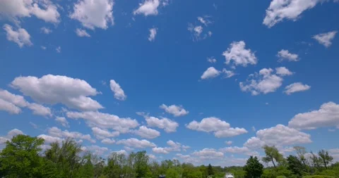 Perfect Blue Sky with Puffy White Clouds Colored and Saturated 4k Plate 16mm 動画素材 154272682
