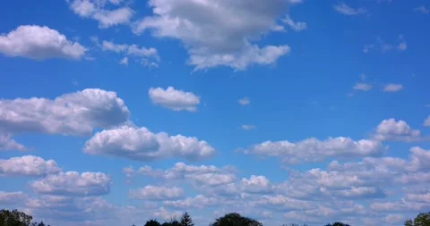 Perfect Blue Sky with Puffy White Clouds Colored and Saturated 4k Plate 24mm 動画素材 154272727