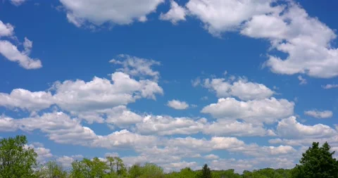 Perfect Blue Sky with Puffy White Clouds Colored and Saturated 4k Plate 24mm Stock Footage 154272738