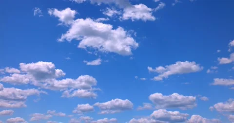 Perfect Blue Sky with Puffy White Clouds Colored and Saturated 4k Plate 35mm Stockbeeldmateriaal 154272771