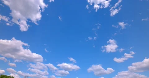 Perfect Blue Sky with Puffy White Clouds Colored and Saturated 4k Plate 50mm 動画素材 154272807