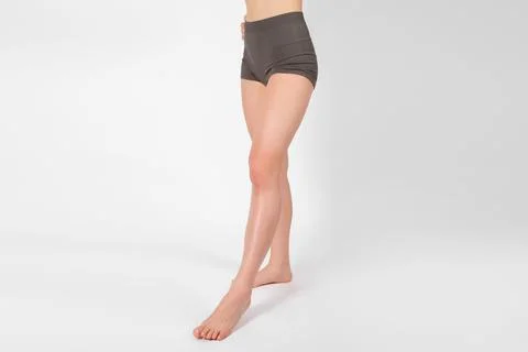 Perfect body shape close up on white background. Great figure of a tanned woman Stock Photos