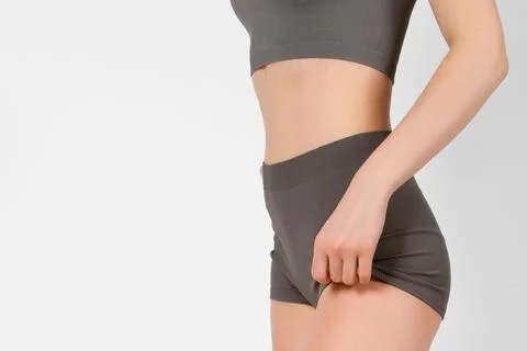 Perfect body shape close up on white background. Great figure of a tanned woman Stock Photos