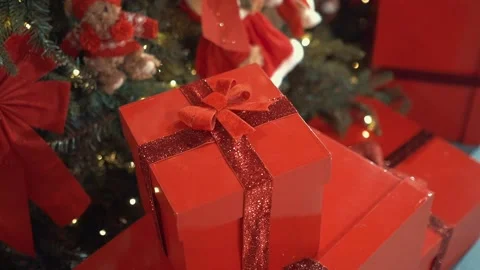 Perfect Christmas red gift boxes with red glitter ribbons and bows in toy store Stockbeeldmateriaal 220094623