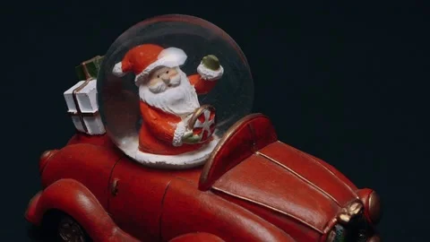 The perfect frame of a toy that represents Santa Claus carrying gifts in the Stock Footage 155203851
