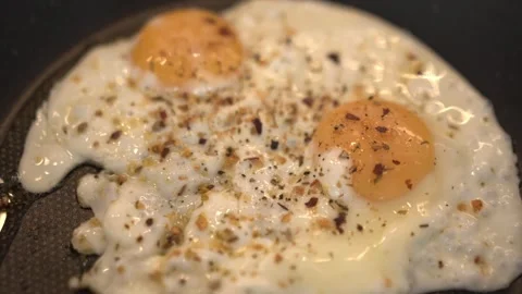 Perfect Fried Eggs with Crispy Edges and Runny Yolks Stock Footage 314405210