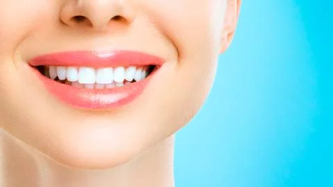 Perfect healthy teeth smile of a young woman. Teeth whitening. Dental clinic Stock Photos
