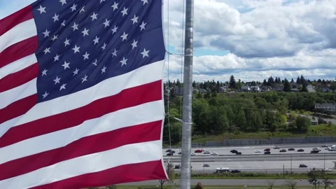 Perfect for Hidden Cut and Transition: Highway reveals American Flag Stock Footage 194576567