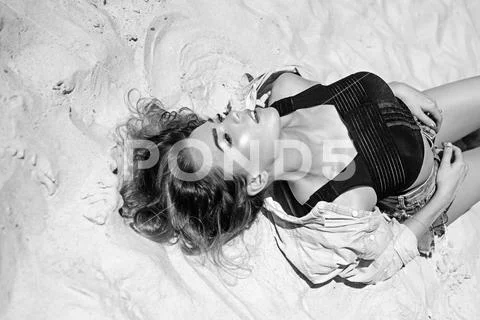 The perfect hideaway for relaxing. Sexi woman on sunny beach. Pretty woman relax Stock Photos