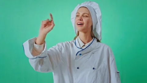 Perfect looking baker lady inside of a green studio chroma key she very Stock Footage 125483763