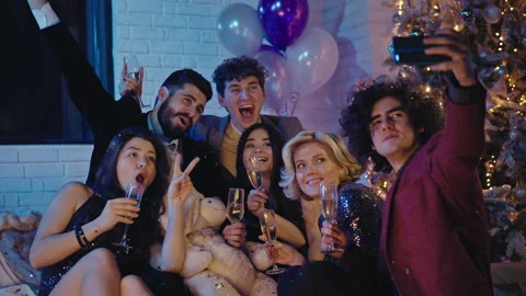 Perfect looking group of young friends celebrating together the Christmas they Stock Footage 137456102