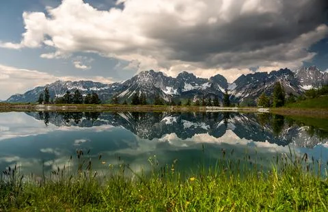 Perfect reflection of the Mountain "Der Wilde Kaiser" in the Lake "Astbergs.. Stock Photos