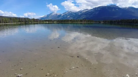 Perfect reflection of mountains in clear water Edith Lake Video stock 159022666