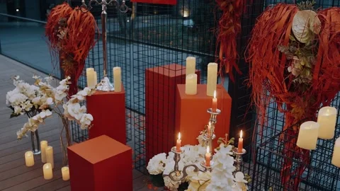 The perfect romantic decor inside with flower candles and heart-shaped ornaments Stock Footage 155203981
