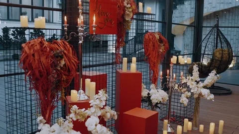 The perfect setting to demonstrate true love, candles, flowers and heart-shaped Stock Footage 155242397