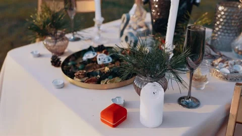 The perfect setting for a table decorated with flowers, cutlery, confections and Video stock 154452639