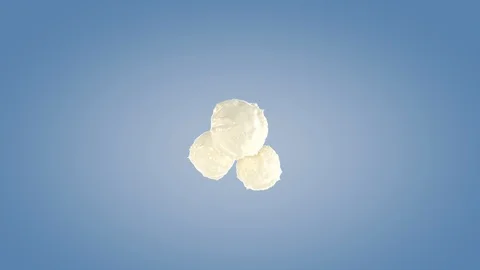 Perfect shape milk splashing isolated on blue background. Stock Footage 117232404