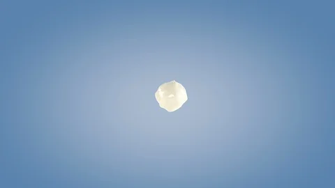 Perfect shape milk splashing isolated on blue background. Stock Footage 117234356