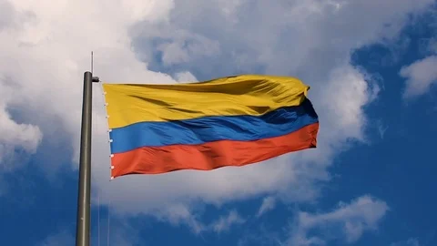 Perfect slow motion shot of Colombian flag in wind with stunning background Stock Footage