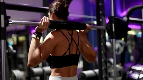 The perfect squat technique emphasizes working on the muscles of the back, legs  Stock Footage 296333415