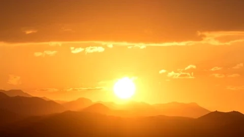 Perfect sunrise with mountains with big orange sun and decent lens flair Stock Footage