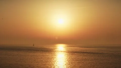 Perfect Timing for a boat at the Sunset or a Sunrise. Cinematic shot in 4k Stock Footage 250798657