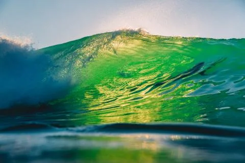 Perfect wave at sunset. Ocean wave for surfing in Hawaii Stock Photos