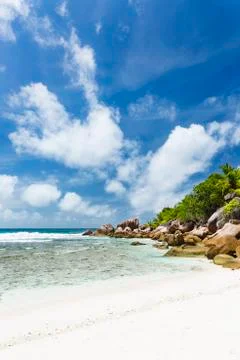 Perfect white beach Anse Cocos in La Digue, Seychelles with granite boulders  Stock Photos