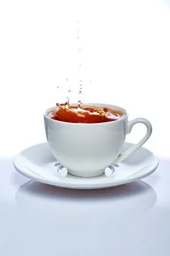 Perfect white cup of tea isolated on white Stock Photos