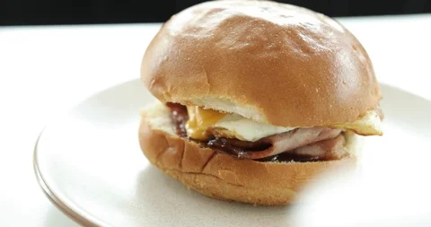A perfectly cooked Bacon and Egg roll Stock Footage 101450342